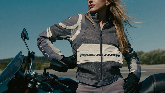 Motorcyclist wearing a ventilated mesh motorcycle jacket on a sunny day